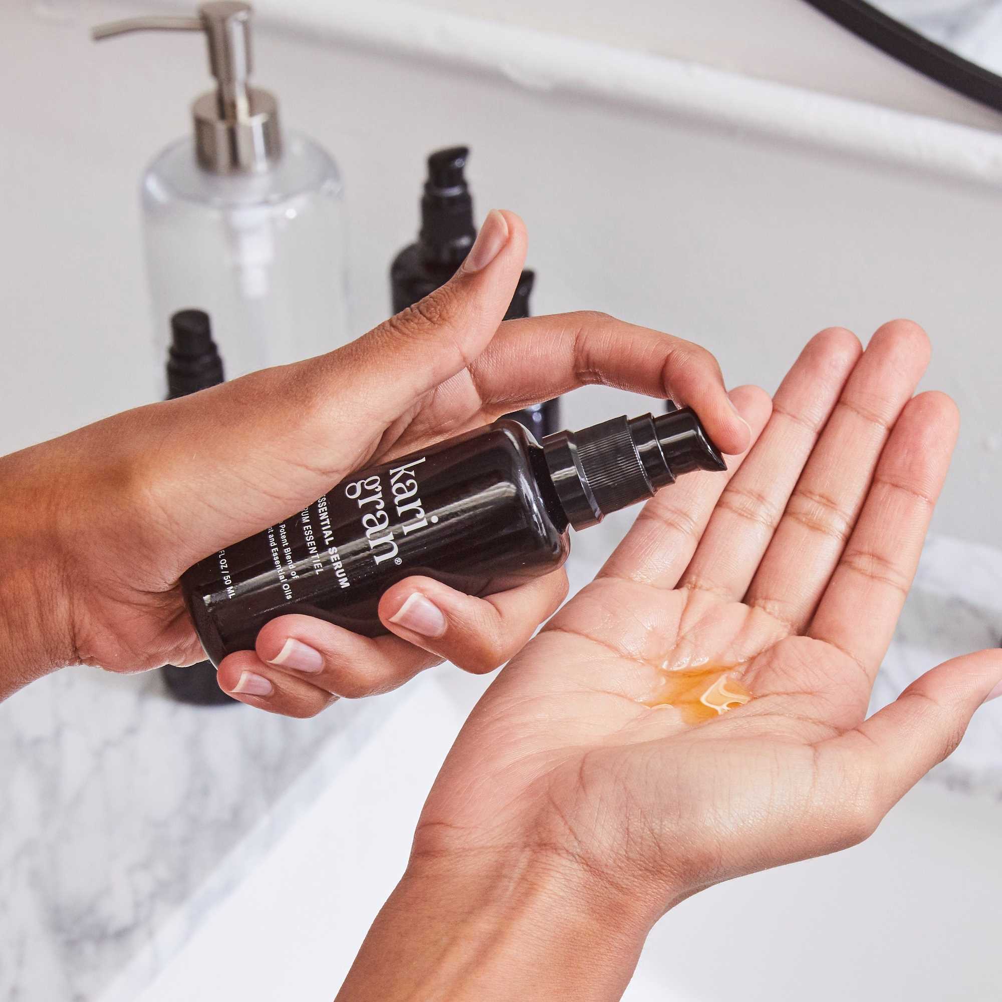 woman pumping Kari Gran products in hand
