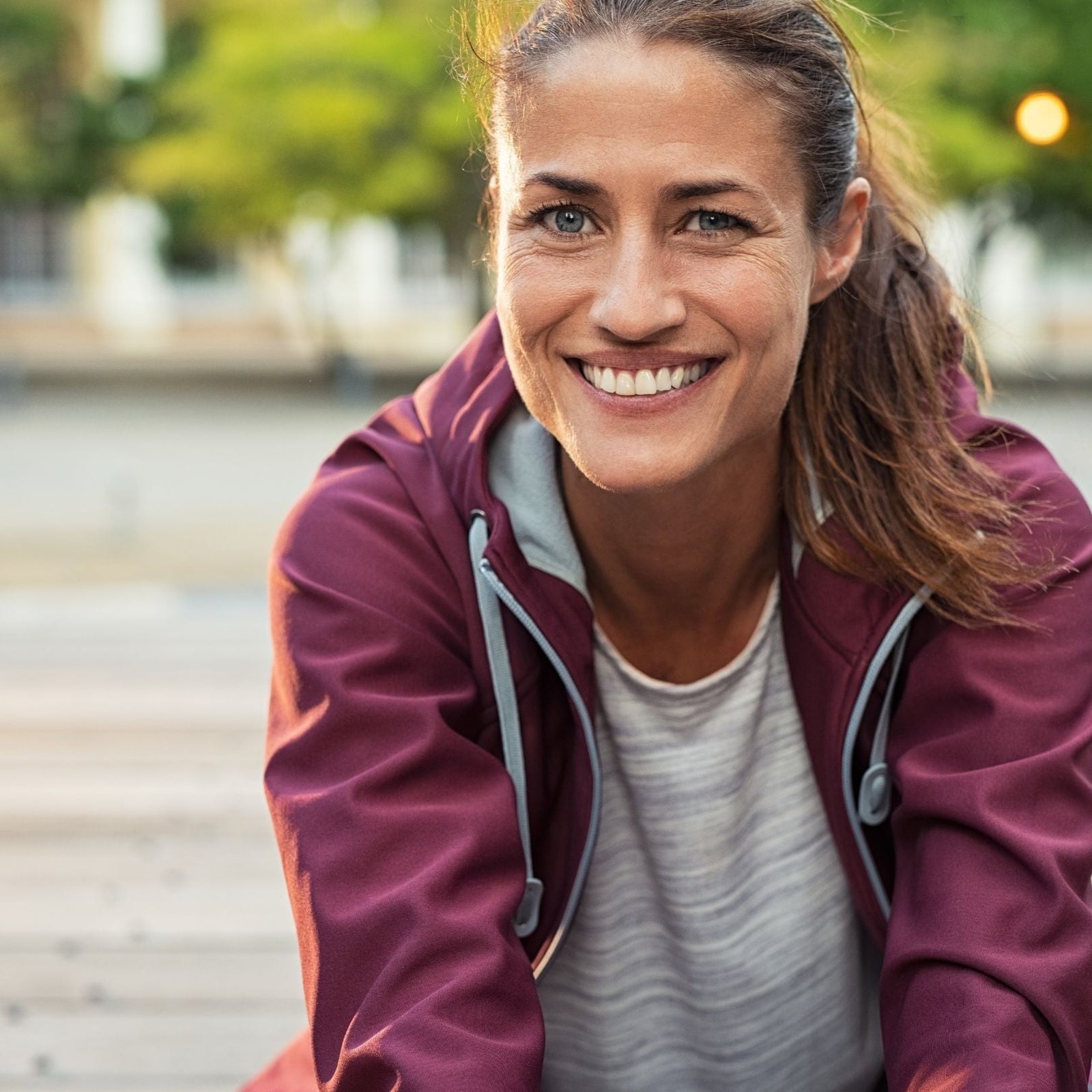 woman smiling in a park