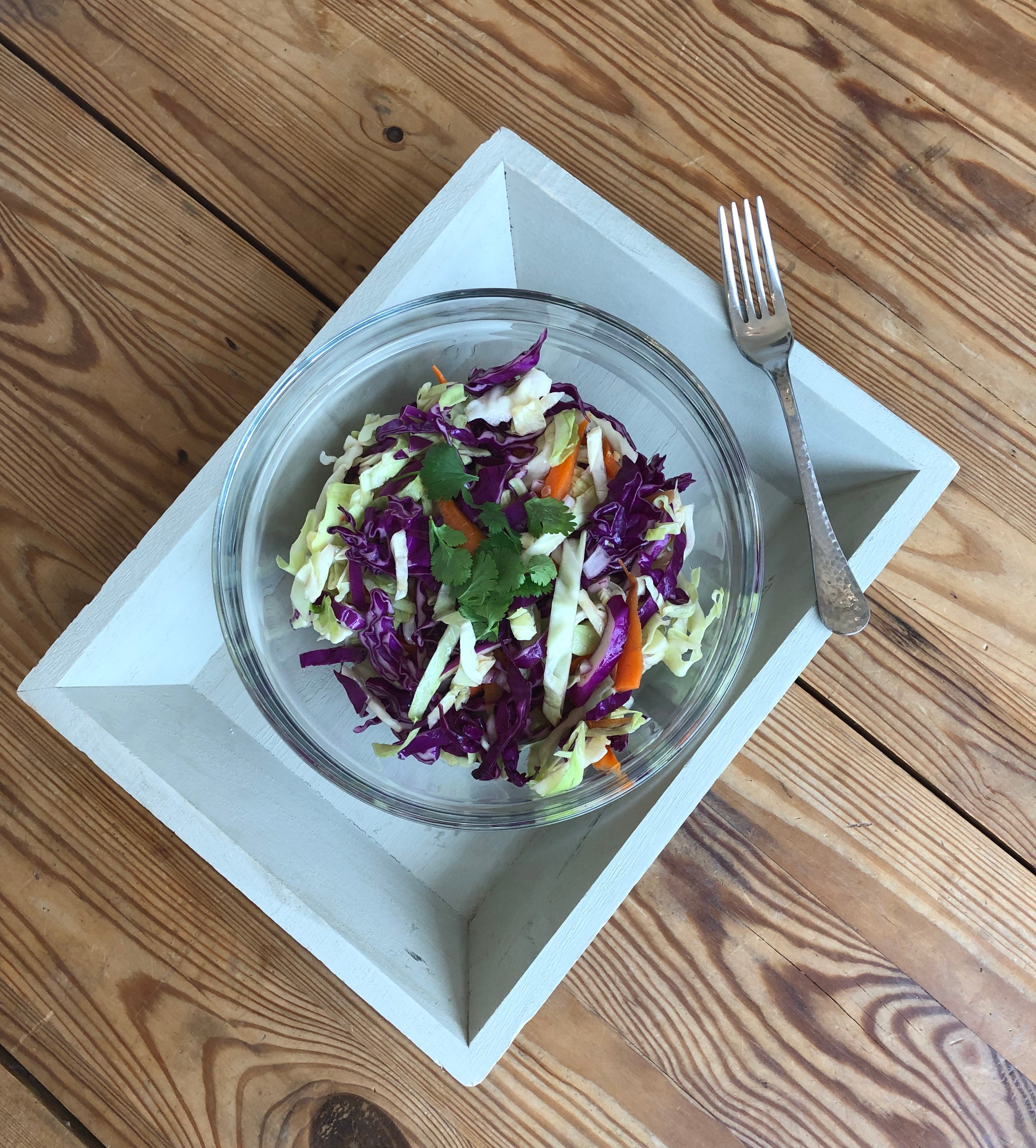 bowl of cabbage salad on tray