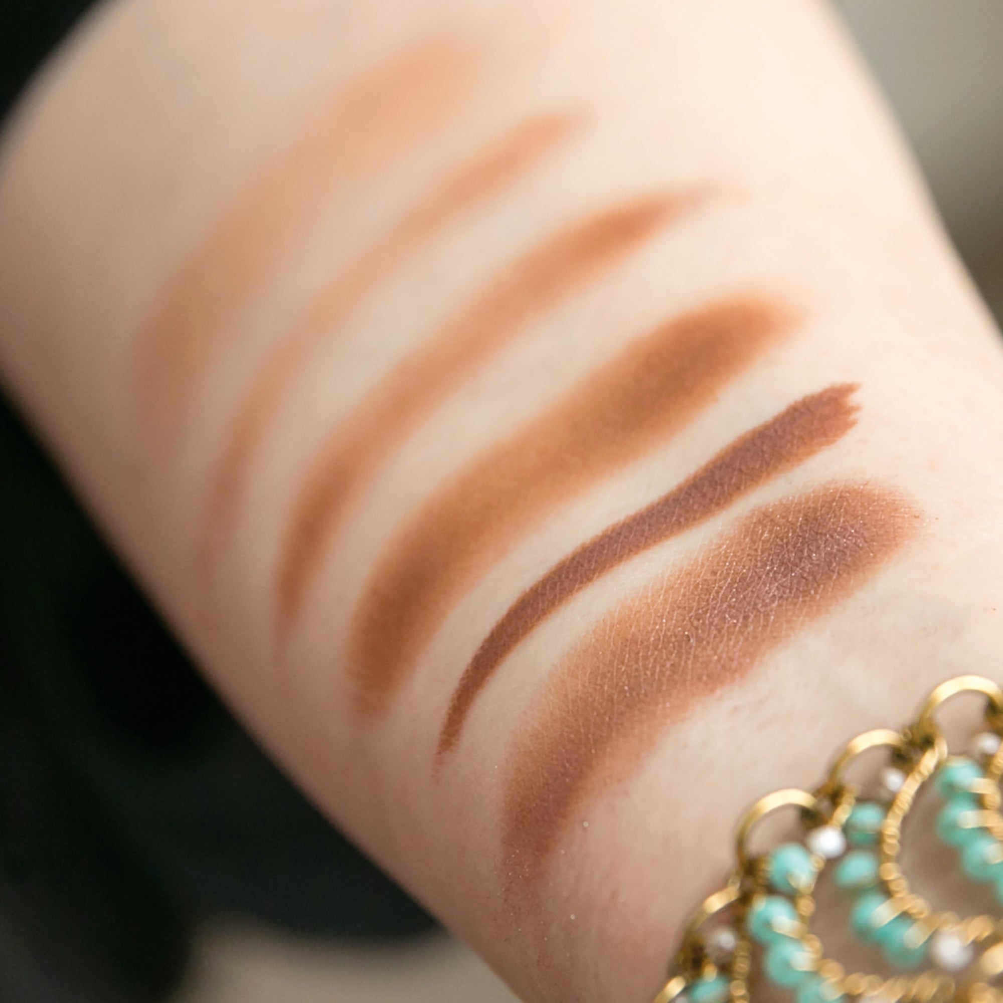 arm with eyeshadow shades