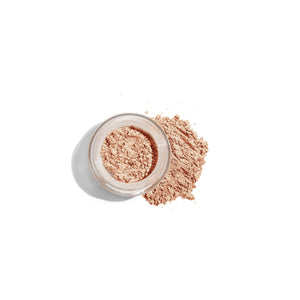 mineral concealer with powder on the side of the jar
