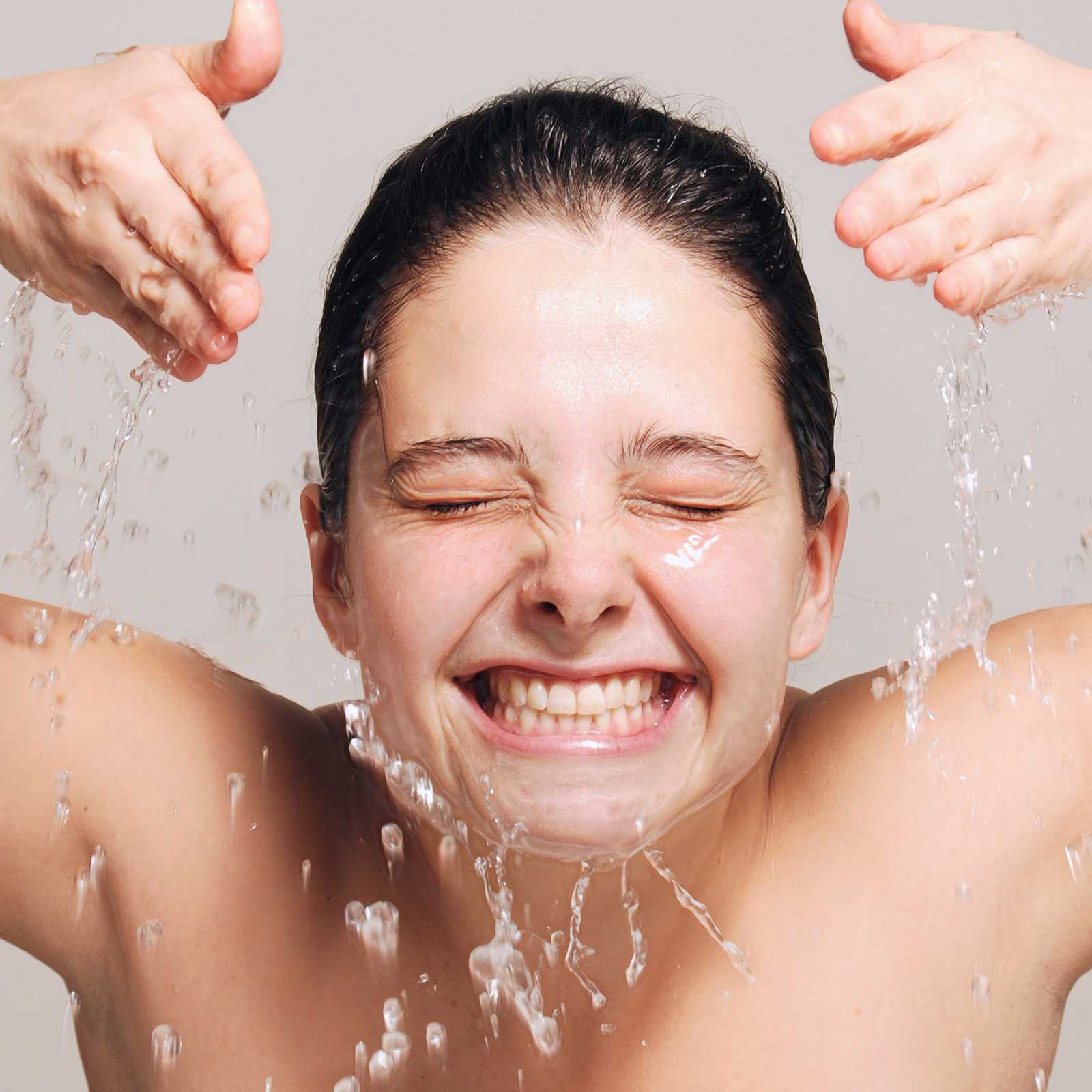 woman splashing herself with water