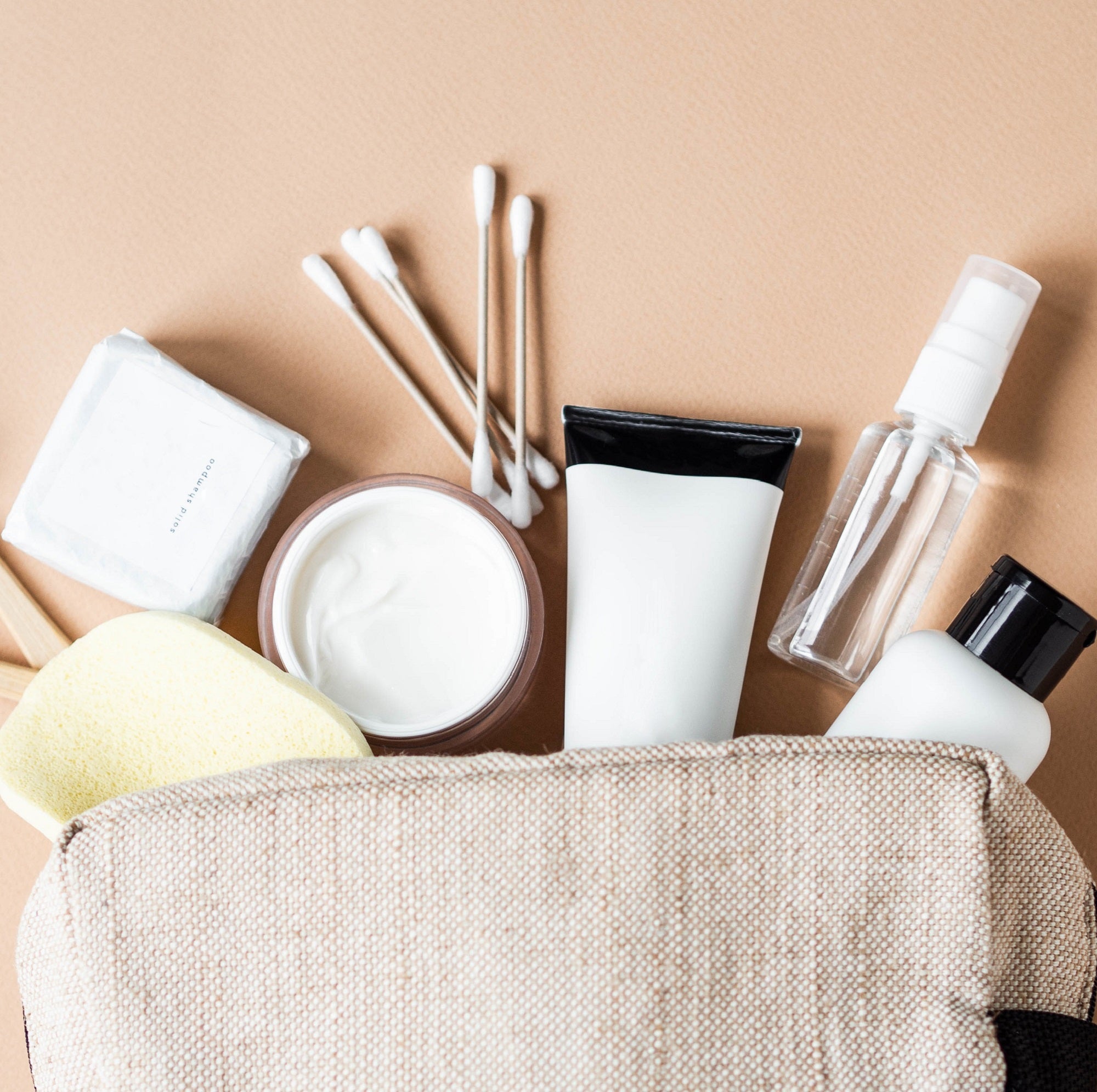 collection of makeup brushes and products
