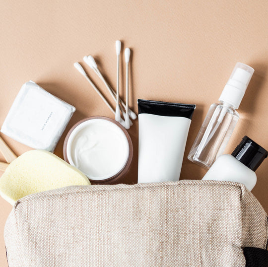 collection of makeup brushes and products