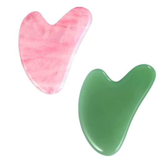 jade qua sha tool and a rose quartz qua sha tool