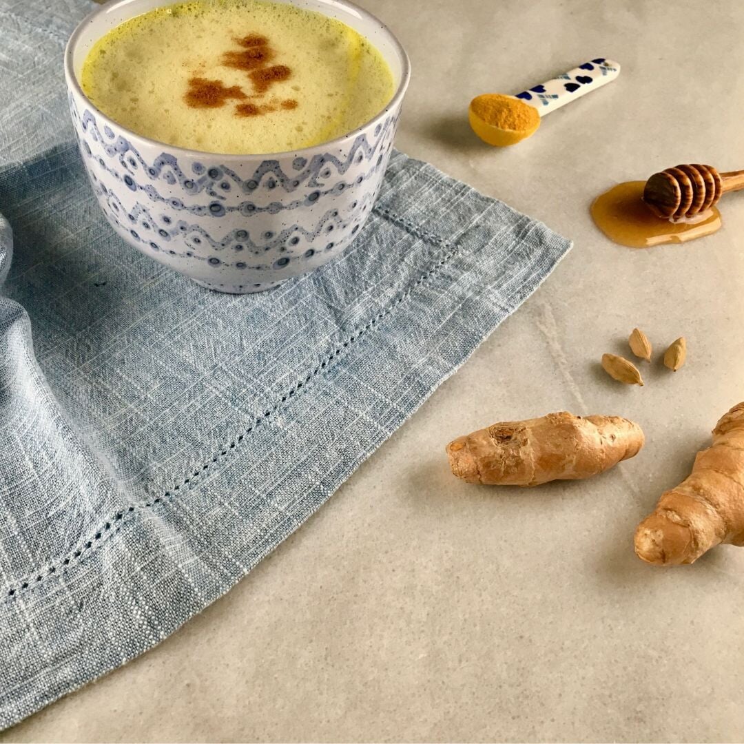 image of latte with ginger next to it.