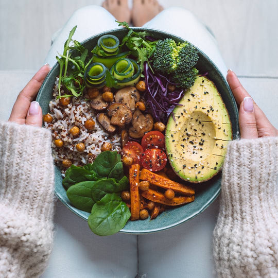 woman holding a salad in her lap