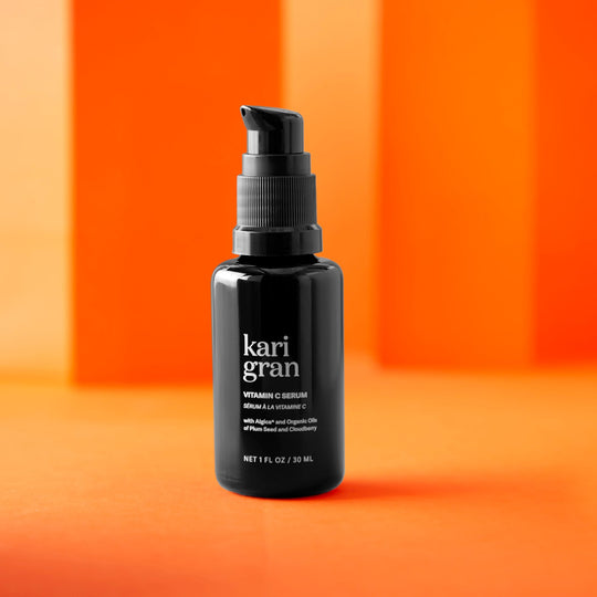 Kari Gran Vitamin C serum on an orange background