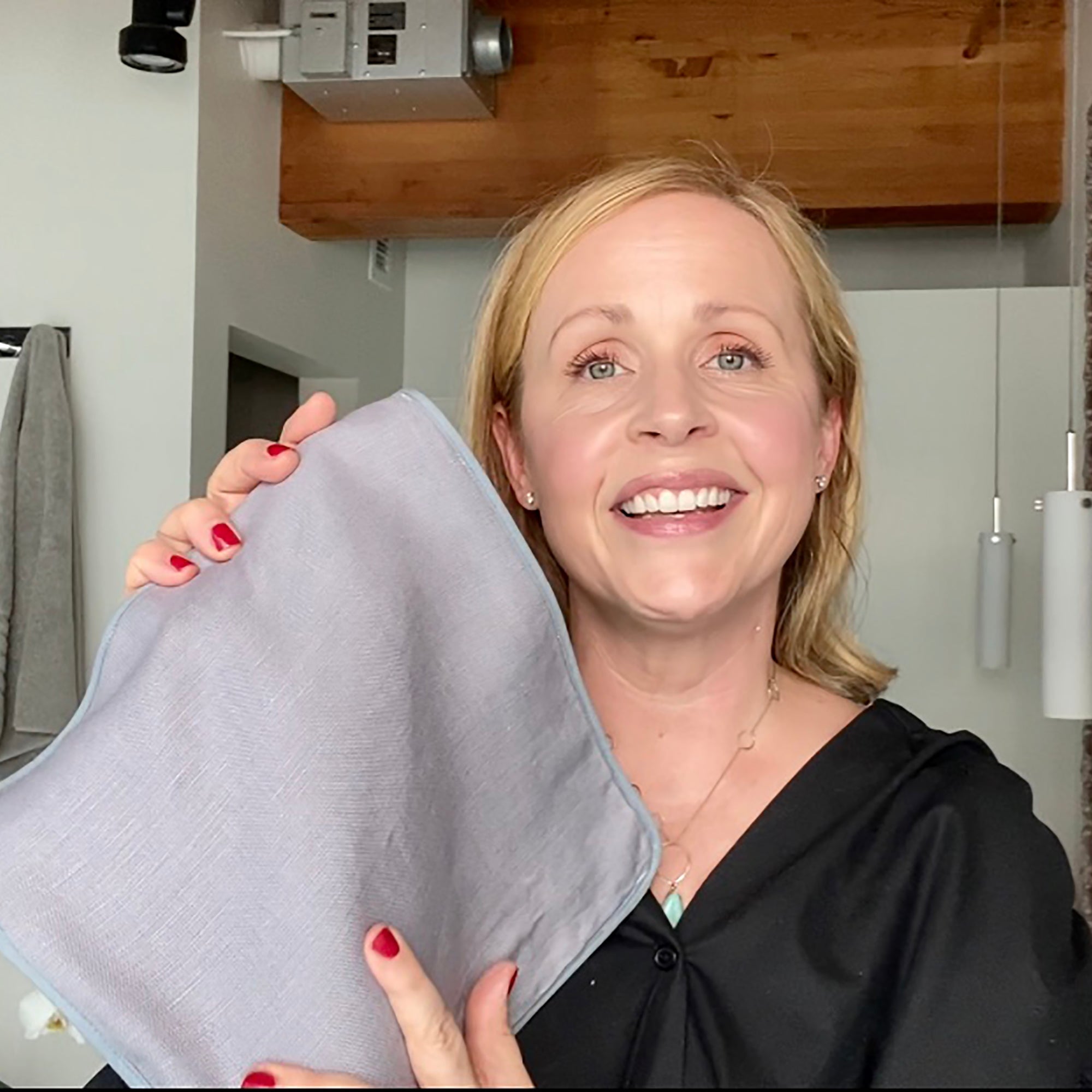 Kari Gran holding the Luxe Exfolating Washcloth