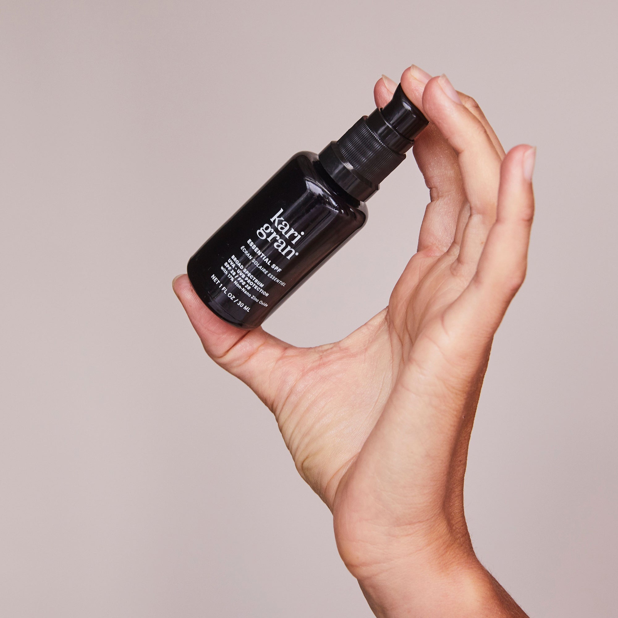 woman holding Kari Gran Essential SPF