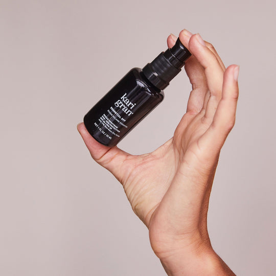 woman holding Kari Gran Essential SPF