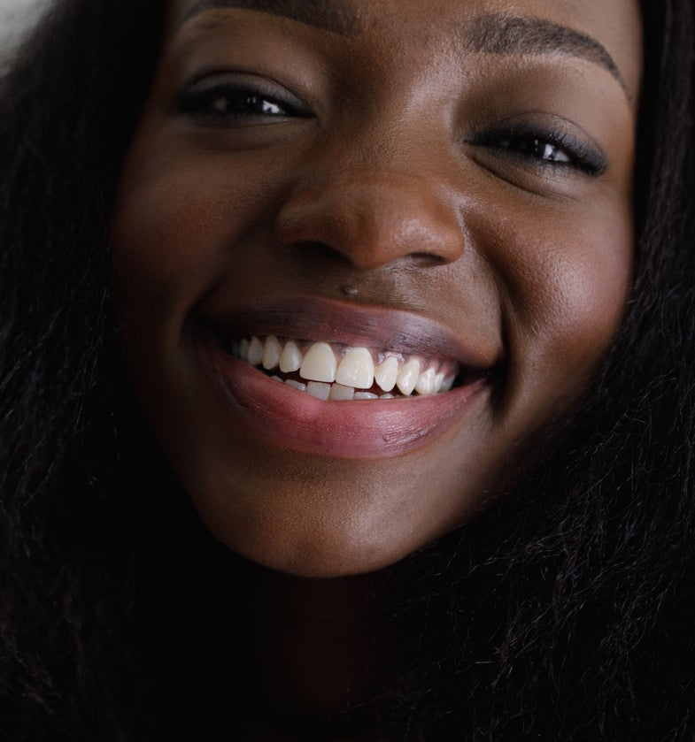 Close-up of a woman's face with a dark background