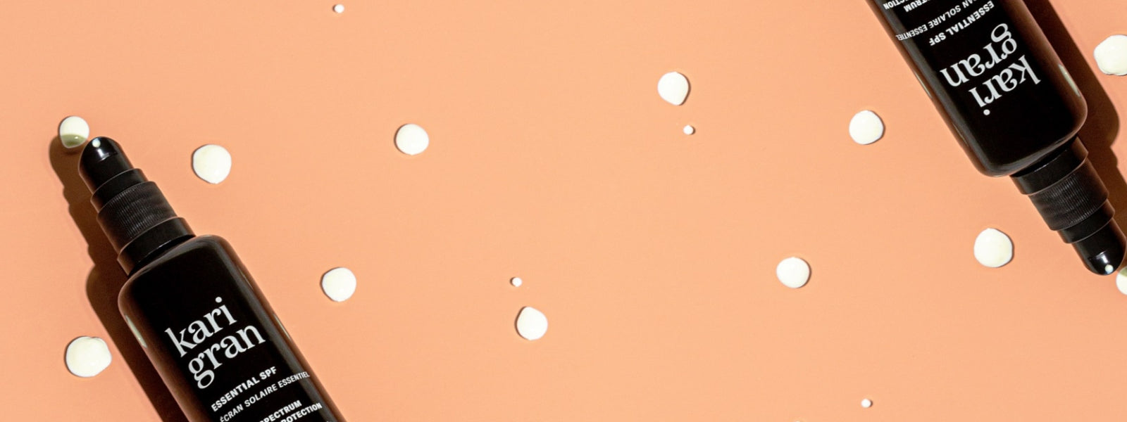 spf bottles on an orange background