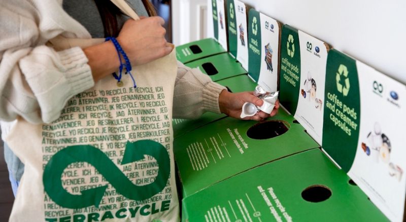 woman putting recycling into boxes
