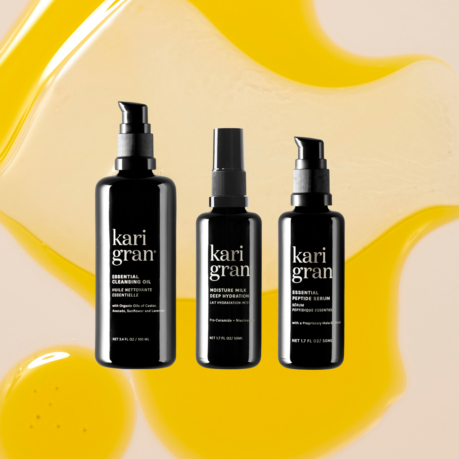 Three black bottles of kari gran products on a yellow and beige abstract background