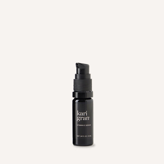 Black serum bottle with 'kari gran' branding on a white background