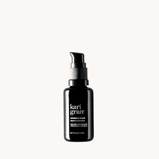 Black serum bottle with 'kari gran' branding on a white background